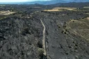 Vue aérienne d'une zone dévastée par des incendies près de Montalba-le-Château, dans les Pyrénées-Orientales, le 7 juillet 2026 ( AFP / LIONEL BONAVENTURE )