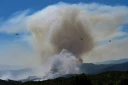 Des Canadair CL-415 de la Sécurité civile en action au-dessus d'un feu de forêt au col des Auzines, près de Trevillach, dans les Pyrénées-Orientales, le 5 juillet 2026l