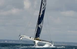 Les skippers français Franck Cammas et Charles Caudrelier à bord du "Maxi Edmond de Rothschild", le 18 juillet 2019 au large de Lorient