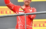 L'Allemand Sebastian Vettel pose sur le podium après sa 2e place au GP de Belgique sur le circuit de Spa-Francorchamps, le 27 août 2017 