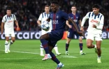 Le défenseur portugais du Paris Saint-Germain Nuno Mendes (au centre) lors du match de Ligue des champions contre l'Atalanta Bergame au Parc des Princes, le 17 septembre 2025 