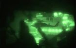 Image tirée d'une vidéo diffusée par le Commandement central américain sur son compte X, le 20 avril 2026, montrant des Marines américains abordant le cargo Touska, battant pavillon iranien en mer d'Arabie, le 19 avril 2026
