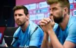 La star du Barça Lionel Messi et son coéquipier Gerard Pique ici en conférence de presse à la cité sportive Joan Gamper près de Barcelone, le 24 mai 2019