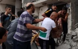 Photo prise le 29 octobre 2023 depuis la frontière entre Israël et la bande de Gaza montrant un nuage de fumée grise s'élever d'un secteur du territoire palestinien, soumis à d'intenses bombardements israéliens 