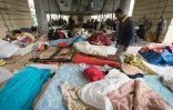 Un camp de migrants installé sous la station de métro Stalingrad à Paris le 23 mars 2016