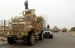 Des forces  progouvernementales au Yémen à bord de véhicules blindés, arrivent dans le secteur d'Al-Durayhimi, à quelque neuf km au sud de l'aéroport de Hodeida, le 13 juin 2018 