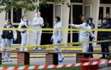 Des policiers devant le collège-lycée d'Arras, où un professeur a été poignardé à mort par un jeune homme fiché pour radicalisation, le 14 octobre 2023