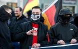 Des drapeaux allemands lors d'une marche de partisans de l'extrême droite à Berlin, le 22 février 2025 