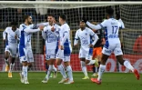 La joie du milieu de terrain troyen Xavier Chavalerin (2e g), après avoir ouvert le score face à Montpellier, lors de leur match en retard de la 20e journée de Ligue 1, le 19 janvier 2022 au Stade de La Mosson