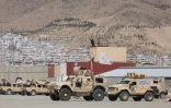 Des véhicules blindés portant le drapeau taliban dans un ancien campd e l'armée américaine, à l'aéroport de Kaboul, le 14 septembre 2021