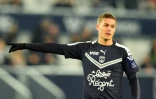 L'attaquant des Girondins de Bordeaux Nicolas de Préville avec le maillot frappé du logo du sponsor Bistro Régent, lors du match de Ligue 1 contre Nîmes le 3 décembre 2019