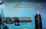 Photo diffusée par son cabinet du président Hassan Rouhani devant le premier moteur turboréacteur iranien, le 21 août 2016 à Téhéran