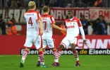 Anthony Modeste (d), avec ses coéquipiers, célèbre l'un de ses buts lors de son triplé face à Hamborg, le 30 octobre 2016 à Cologne