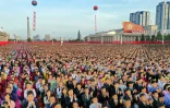 Photo diffusée le 10 octobre 2020 par l'agence nord-coréenne KCNA de Nord-Coréens assistant aux cérémonies pour le 75e anniversaire de la fondation du Parti des travailleurs, à Pyongyang