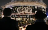 Photo prise le 15 novembre 2015 d'un mémorial installé sur la place de la République à Paris en hommage aux victimes des attentats du 13 novembre