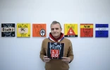 Le créateur de mode Jean-Charles de Castelbajac pose le 1er février 2018 devant ses toiles et dessins exposés à la galerie Magda Danysz à Paris
