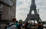 Des passants devant la Tour Eiffel à Paris, le 29 avril 2022