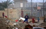 Des enfants jouent dans une rue de Fallouja, en Irak, le 3 janvier 2016