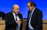 Michel Platini et Sepp Blatter s'entretiennent lors du 64e congrès de la Fifa le 11 juin 2014 à Sao Paulo, la veille de l'ouverture du Mondial de football