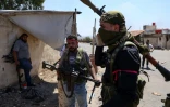 Des combattants de tribus bédouines se rassemblent dans le village d'al-Mazraa, dans le gouvernorat de Soueida, adans le sud de la Syrie, sur fond d'affrontements avec des hommes armés druzes, le 18 juillet 2025