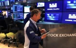 Trader sur le parquet du New York Stock Exchange (NYSE), le 14 mai 2026
