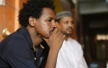 Youssef (g et Mudther (f), les frères d'Ali tué en juin pendant la dispersion d'un sit-in à Khartoum, dans leur maison familiale, le 7 juillet 2019 au Soudan