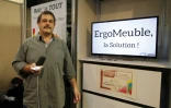 Le deuxième prix du "Concours Lepine"  Thierry Gevrey près de son invention ErgoMeuble, un système de rangement qui permet l'accès à chaque tiroir par télécommande, à Paris le 7 mai 2016