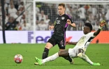 L'attaquant du Real Madrid Vinicius et le milieu du Bayern Munich Joshua Kimmich lors de la demi-finale de Ligue des champions, au stade Santiago Bernabéu de Madrid, le 8 mai 2024