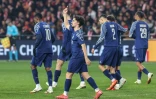 Le milieu du Paris Saint-Germain Vitinha fête son penalty marqué contre le Stade Brestois 29 lors du barrage aller de Ligue des champions au stade du Roudourou de Guingamp le 11 février 2025 en France 