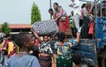 Des réfugiés congolais fuyant les violences dans l'est de leur pays arrivent dans le camp de Gihanga au Burundi le 17 février 2025