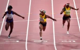 La Jamaïcaine Shelly-Ann Fraser-Pryce (c) remporte la finale du 100 maux Mondiaux de Doha le 29 septembre 2019