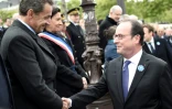 L'ancien président Nicolas Sarkozy (g) et son successeur à l'Elysée François Hollande, lors des cérémonies de commémoration du 8 mai 1945; sur les Champs-Elysées à Paris, le 8 mai 2017