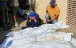 Une Palestinienne pleure près de leurs corps la mort de ses proches tués après un  bombardement israélien à Deir el-Balah, dans le centre de la bande de Gaza, le 10 juillet 2024