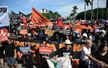 Des manifestants lors d'un rassemblement à Manille contre les faux projets "fantômes" de lutte contre les inondations, l'un des plus grands scandales de corruption que les Philippines aient connu depuis des décennies, le 21 septembre 2025