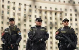 Des policiers des forces spéciales montent la garde sur la place Tahrir, au Caire, le 25 janvier 2016, pendant l'anniversaire du soulèvement de 2011