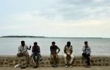 Residents spend their morning on a beach next to the port in Nadi on October 4, 2026, ahead of the Pacific Pre-COP31 Summit's opening ceremony.