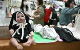 Des visiteurs lors d'un salon de l'enfant, le 30 avril 2026 à Séoul 