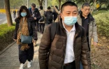 Ren Quanniu (c) un des avocats de Zhang Zhang arrive au tribunal à Shanghai, le 28 décembre 2020