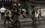 Un combattant du M23 marche dans une rue du quartier de Keshero à Goma (République démocratique du Congo), le 27 janvier 2025