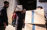 Distribution de colis alimentaires fournis par le Programme alimentaire mondial le 27 octobre 2025 dans la bande de Gaza