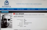 Une reproduction du site d'Interpol montrant la fiche de recherche du braqueur français Redoine Faïd, échappé de sa prison de Réau (Seine-et-Marne) le 1er juillet 2018
