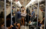 Des personnes masquées dans le métro de Londres, le 9 août 2021