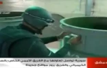 Un inspecteur de l'OIAC dans un lieu tenu secret en Syrie sur une capture d'écran de la télévision syrienne le 19 octobre 2013