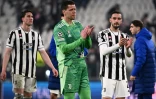 L'attaquant serbe Dusan Vlahovic, le gardien polonais Wojciech Szczesny et le défenseur Mattia De Sciglio, éliminés avec la Juventus après la défaite à domicile, 3-0 face à Villareal, lors du 8e retour de finale retour de la Ligue des Champions, le 16 mars 2022 à Turin