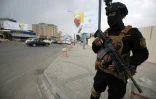 Un membre des forces spéciales irakiennes devant l'église syriaque catholique Notre-Dame de la Délivrance, avant l'arrivée du pape François à Bagdad, le 4 mars 2021