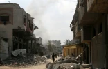 De la fumée s'élève après une frappe israélienne sur le quartier Abou Iskandar du nord de Gaza-ville, pilonnée par l'armée israélienne en vue d'une offensive annoncée au sol, le 22 août 2025