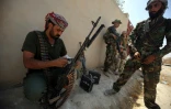 Des combattants du Hachd al-Chaabi avançent dans Tal Afar, le 23 août 2017