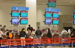 Des voyageurs à l'aéroport international de Dubaï, le 21 février 2022