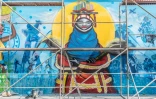 Une fresque murale de l'artiste béninois Lionel Attere pendant le festival Effet Graff, le 18 mai 2022 à Cotonou, au Bénin