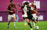 Le milieu français de la Juventus Adrien Rabiot ouvre le score sur le terrain de l'AC Milan, le 7 juillet 2020 au stade San Siro
